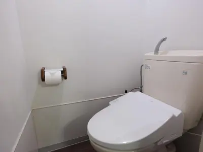 a bathroom with a toilet with a roll of toilet paper at Hatagaya heim 403 in Tokyo