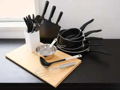 a table with a cutting board with utensils on it at Hatagaya heim 403 in Tokyo