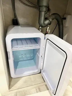 a microwave oven with its door open in a room at fukuhana\u6771\u65b0\u5bbf in Tokyo