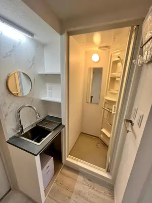 a small kitchen with a sink and a refrigerator at fukuhana\u6771\u65b0\u5bbf in Tokyo