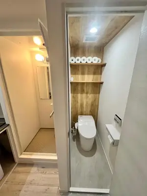 a small bathroom with a toilet and a shower at fukuhana\u6771\u65b0\u5bbf in Tokyo