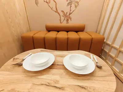 a wooden table with two white plates and a chair at G19\u65b0\u5bbf\u6700\u4e2d\u5fc3 \u6771\u65b0\u5bbf\u7ad95\u5206-Shinjuku center 5 mins to Station, Max 4 \u76f4\u8fbe\u65b0\u5bbf \u6d89\u8c37 \u8868\u53c2\u9053 \u6c60\u888b \u4e0a\u91ce \u4ee3\u4ee3\u6728 \u94f6\u5ea7 \u539f\u5bbf in Tokyo