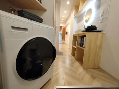 a white washer and dryer in a room at G19\u65b0\u5bbf\u6700\u4e2d\u5fc3 \u6771\u65b0\u5bbf\u7ad95\u5206-Shinjuku center 5 mins to Station, Max 4 \u76f4\u8fbe\u65b0\u5bbf \u6d89\u8c37 \u8868\u53c2\u9053 \u6c60\u888b \u4e0a\u91ce \u4ee3\u4ee3\u6728 \u94f6\u5ea7 \u539f\u5bbf in Tokyo