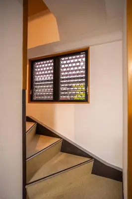 a staircase in a house with a window at Miyabi Inn-Kameido in Tokyo