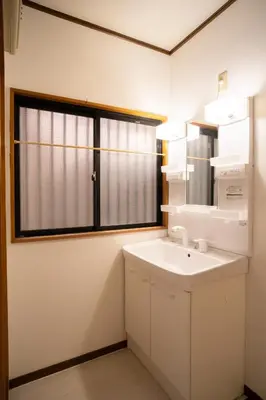 a bathroom with a sink and a window at Miyabi Inn-Kameido in Tokyo