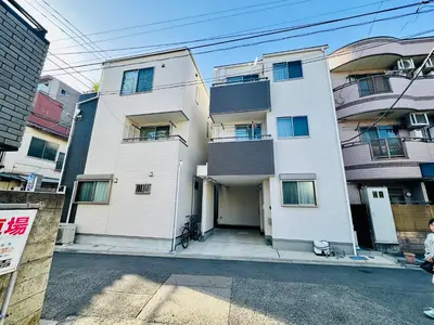 a large white building with a lot of windows at MoRi House IN西日暮里Ⅱ in Tokyo