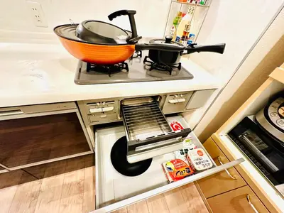 a kitchen counter with a bowl on a stove at MoRi House IN西日暮里Ⅱ in Tokyo
