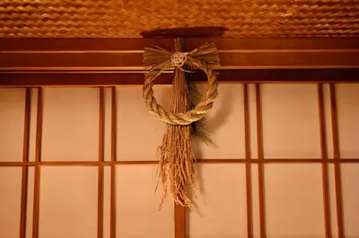 a rope hanging on a wall next to a window at ICHINAGI Yanaka Luxury Villa near Asakusa in Tokyo