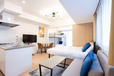 a small apartment with a bed and a kitchen and a living room at Sun Place \u795e\u697d\u5742 in Tokyo