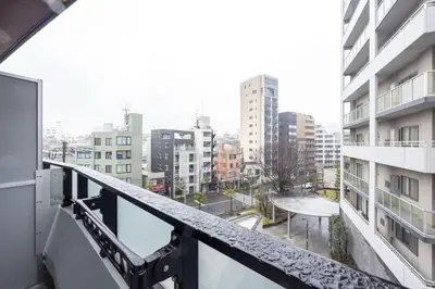 a balcony with a view of a city at Sun Place \u795e\u697d\u5742 in Tokyo