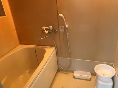 a small bathroom with a tub and a toilet at RIKASOU#101 in Tokyo