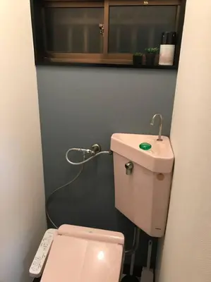 a small bathroom with a toilet and a sink at RIKASOU#101 in Tokyo
