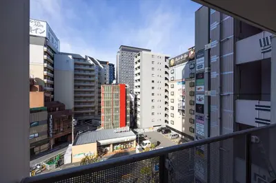 a view of a city from a balcony at \u30d7\u30e9\u30fc\u30ba\u30bf\u30ef\u30fc\u6771\u65b0\u5bbf in Tokyo