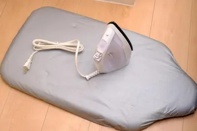 a device sitting on a pillow on a floor at Modern Meguro Apt - 2 Mins Walk - Direct to Shibuya,Ebisu,Haneda - \u9577\u8005\u4e38\u30d3\u30eb in Tokyo