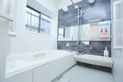 a white bathroom with a tub and a sink at 東京寓 - Spacious Traditional Home & Zen Garden - For Family&Group up to 8 ppl in Tokyo