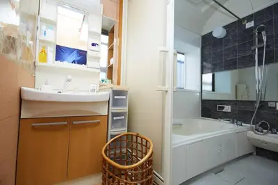 a bathroom with a sink and a bath tub at 東京寓 - Spacious Traditional Home & Zen Garden - For Family&Group up to 8 ppl in Tokyo