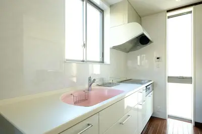 a pink sink in a white kitchen with a window at Nishi-Shinjuku Residence - 2F House - Quiet Area Walkable to Shinjuku Station - Ciel\u897f\u65b0\u5bbf in Tokyo