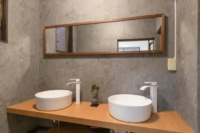 a bathroom with two sinks and a mirror at Shinjuku Zen House 1F 70sqm Spacious Townhouse No Stairs R1 in Tokyo