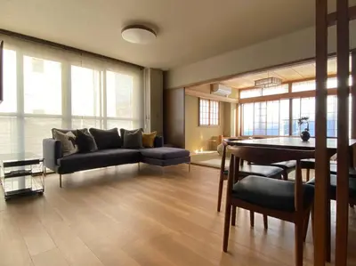a living room with a couch and a table at SHINJUKU Luxury MIYABI Huge 150m2 Penthouse 3 Levels Max 12PPL in Tokyo