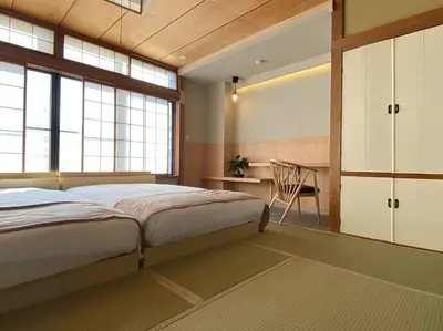 a bedroom with a bed and a desk with a chair at SHINJUKU Luxury MIYABI Huge 150m2 Penthouse 3 Levels Max 12PPL in Tokyo