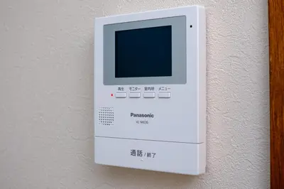 a white computer monitor hanging on a wall at Board Game House Tokyo - Authentic Old Tokyo - 3 BR House - 15mins to Asakusa, Skytree in Tokyo