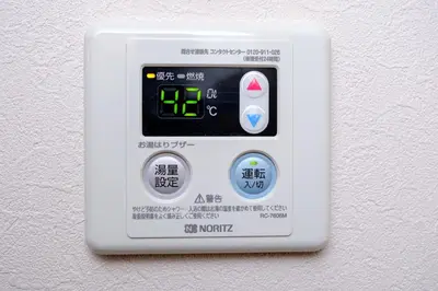 a white electrical outlet with an air temperature gauge at Board Game House Tokyo - Authentic Old Tokyo - 3 BR House - 15mins to Asakusa, Skytree in Tokyo