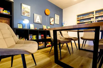 a room with chairs and a table in a store at Board Game House Tokyo - Authentic Old Tokyo - 3 BR House - 15mins to Asakusa, Skytree in Tokyo
