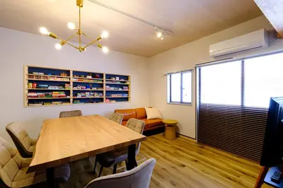 a conference room with a wooden table and chairs at Board Game House Tokyo - Authentic Old Tokyo - 3 BR House - 15mins to Asakusa, Skytree in Tokyo