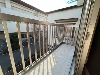 a balcony of a building with a view of a street at Saitore in Tokyo