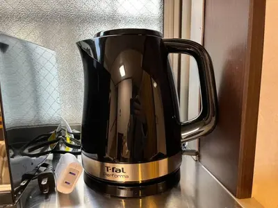 a black coffee pot sitting on top of a counter at Saitore in Tokyo