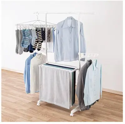 a clothes rack with clothes on it in a room at AKEBONOBASHI Detached house HA1 in Tokyo