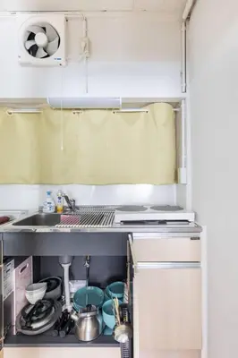 a kitchen with a sink and a stove at AKEBONOBASHI Detached house HA1 in Tokyo