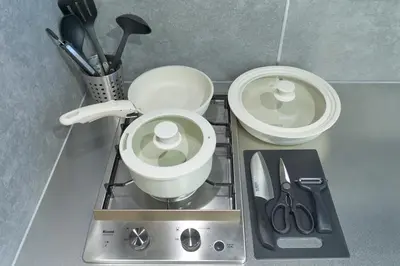 a kitchen counter with two white bowls and utensils at MATSUMIZAKA Hill by Tranova in Tokyo