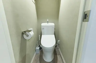 a bathroom with a toilet in a bathroom stall at MATSUMIZAKA Hill by Tranova in Tokyo
