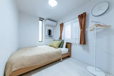 a bedroom with a bed and a glass shower at HOTEL Peerson - Vacation STAY 73421v in Tokyo