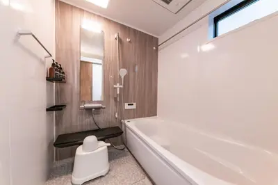 a bathroom with a tub and a toilet in it at HOTEL Peerson - Vacation STAY 73421v in Tokyo