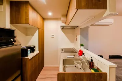 a small kitchen with a sink in a room at Seirai Asakusa Vacation Rental - Vacation STAY 81001v in Tokyo