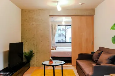 a living room with a couch and a bed at Seirai Asakusa Vacation Rental - Vacation STAY 81001v in Tokyo