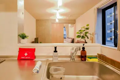a kitchen sink with a red bag on top of it at Seirai Asakusa Vacation Rental - Vacation STAY 81015v in Tokyo