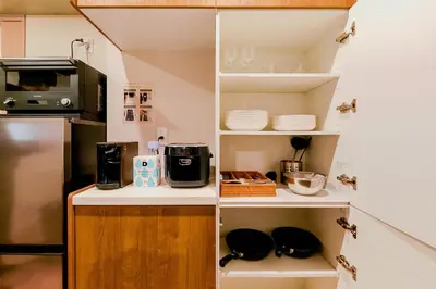 a kitchen with white shelving and a counter top at Seirai Asakusa Vacation Rental - Vacation STAY 80997v in Tokyo