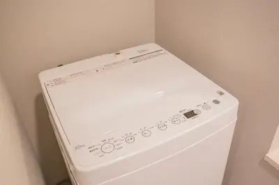 a white washer and dryer in a room at The most comfortable and best choice for accommodation in Yoyogi EoE5 in Tokyo