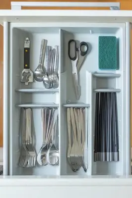 a refrigerator filled with utensils and utensils at SKY GATE Azabu in Tokyo