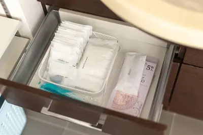 a drawer filled with towels and other items at SKY GATE Azabu in Tokyo