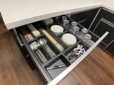 a drawer in a kitchen with dishes and utensils at \u6d17\u8db321 in Tokyo