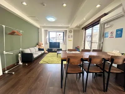 a living room with a table and a couch at \u6d17\u8db321 in Tokyo