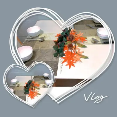 two hearts with a vase in the middle of a table at Ikebukuro 702 in Tokyo