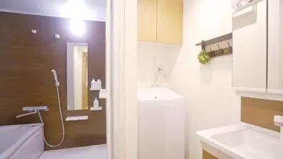 a bathroom with a shower and a sink at TOKYO AKATSUKI HOTEL in Tokyo