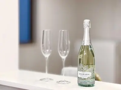a bottle of wine sitting next to two wine glasses at Otsuka House-TS0006 in Tokyo