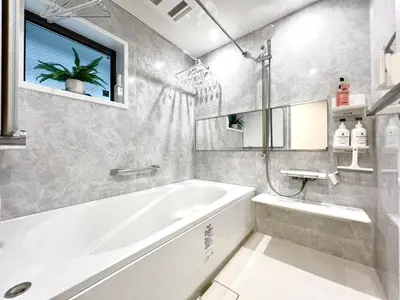 a white bathroom with a tub and a sink at Otsuka House-TS0006 in Tokyo