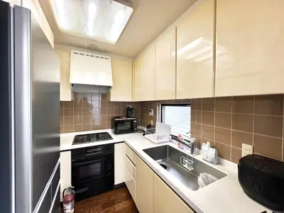a kitchen with a sink and a stove at Hanegi House -SE0417 in Tokyo